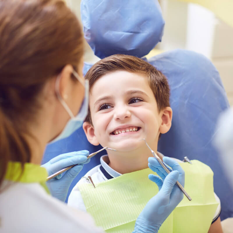 Kid smiling at the dentist